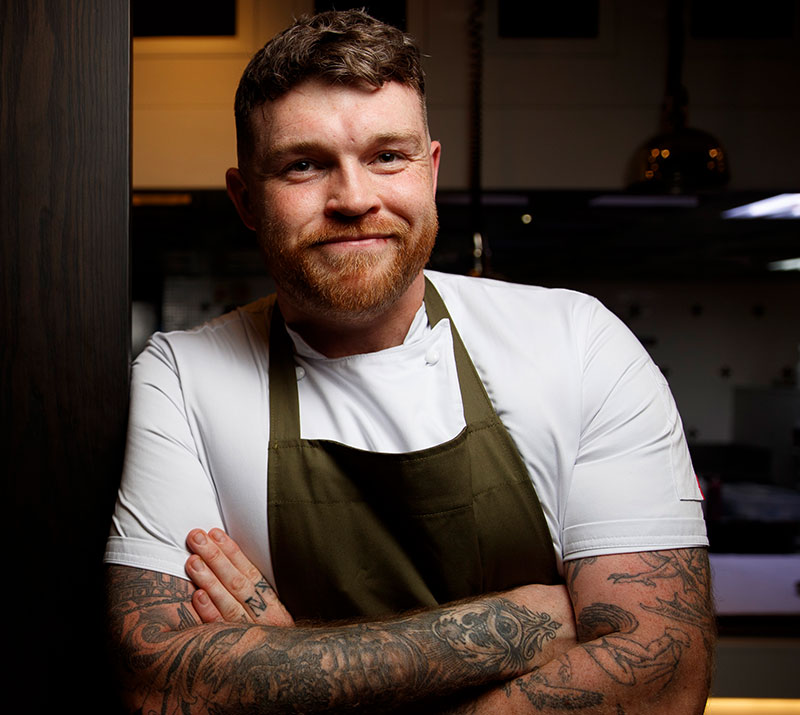 An Image of chef Tom Brown who is appearing at Signature Food Festival 2026's Musical Evening