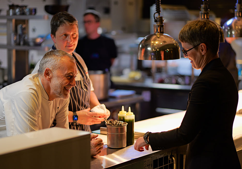 An Image of Michel Roux Jr prepping at Signature Food Festival 2024